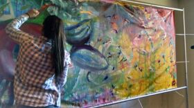 FILE PHOTO: Student Natalya Vega of Rochester's School of the Arts paints a mural at the Hyatt Hotel in downtown Rochester in 2015.