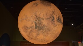A 10-foot illuminated model of Mars created by British artist Luke Jerram is the centerpiece of the Peoria Riverfront Museum's new exhibit around the Red Planet. The model was sponsored by Sheldon and Mary Ann Schafer.