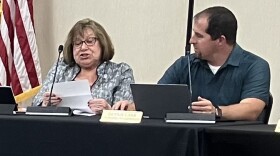 Washington Mayor Lilija Stevens and interim city administrator Dennis Carr discuss an agenda item before the city council's June 2 meeting.