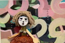 Female figure made of vegetable steamer skirt, bone legs and Barbie boot
