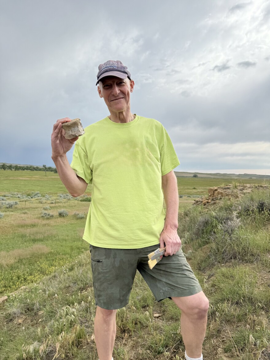 Mark Russell Smith, Quad City Symphony conductor, as part of the dinosaur dig site in June 2025 in eastern Wyoming, organized by the Putnam.