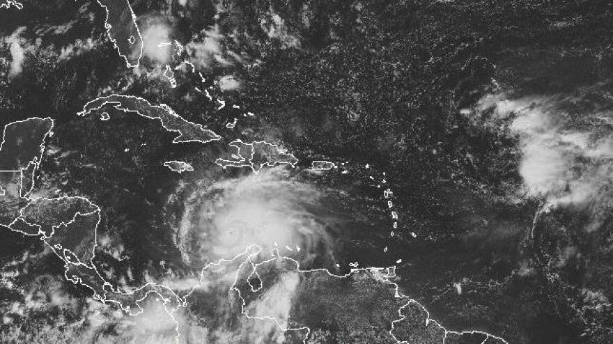 A satellite image shows Hurricane Matthew's location around midday Saturday. The storm is expected to move to the north and northwest.