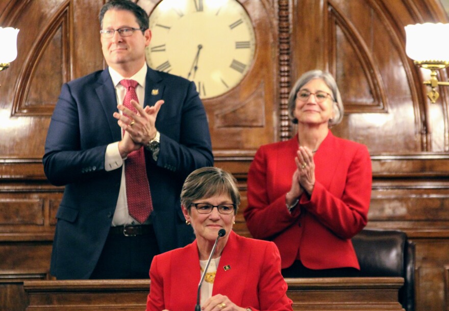 Democratic Gov. Laura Kelly delivers her first State of the State speech on Wednesday night, flanked by Republicans House Speaker Ron Ryckman and Senate President Susan Wagle.