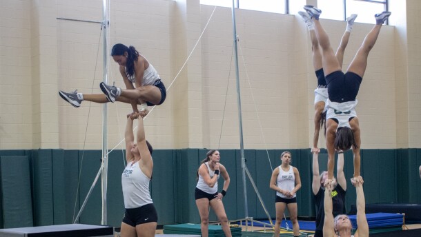 Members of the Baylor Acrobatics and Tumbling team practice coordinated lifts during a practice session in September.