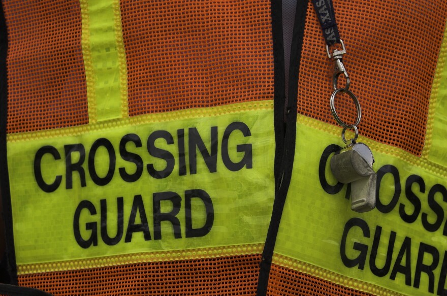 Crossing guard vest and whistle