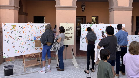 Local tucsonans paints on canvases during Tucson Meet Yourself at the historic Pima County Courthouse on Oct. 17, 2026.