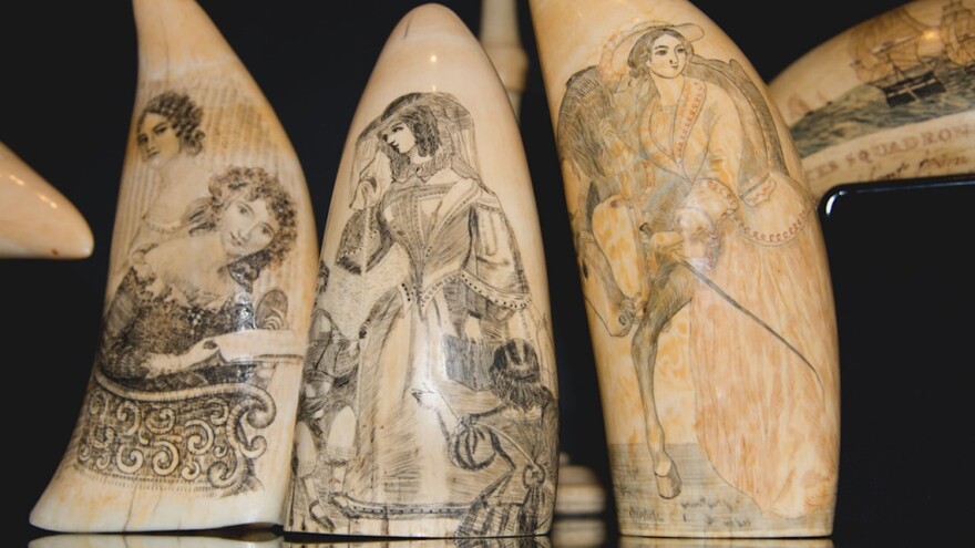 Nineteenth-century scrimshaw art pieces depict women from the Victorian era.