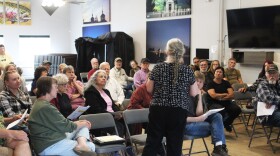 Debbie Cary (foreground) speaks to attendees at a community meeting on Thursday, July 17, 2025 in Ninilchik, Alaska.