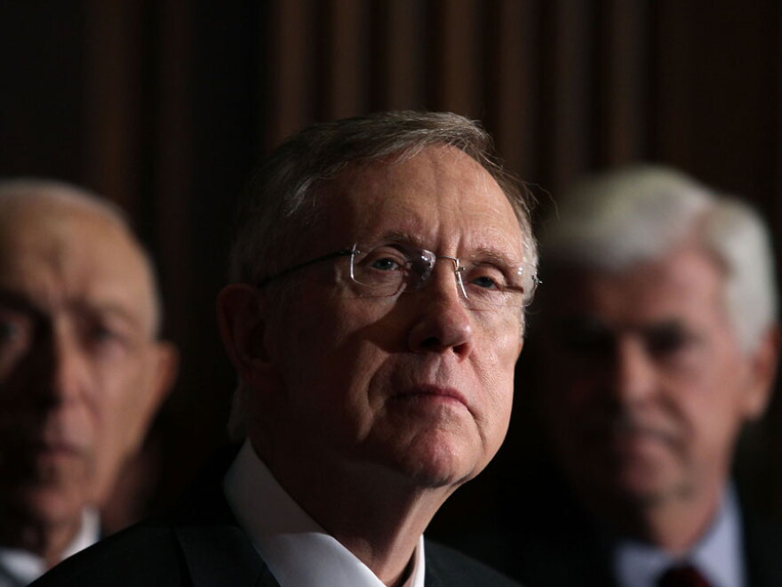 Senate Majority Leader Harry Reid of Nevada (center), flanked by fellow Democratic Sens. Frank Lautenberg of New Jersey (left) and Christopher Dodd of Connecticut, speaks Thursday after the chamber approved a package of changes to the recently passed health care legislation. The measure then was sent to the House for final approval.