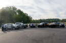 South Carolina police officers stand in front of patrol cars.