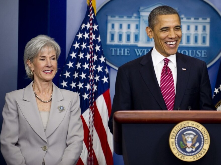 Barack Obama stands with Health and Human Services Secretary Kathleen Sebelious as he announces that insurance companies and not religious employers will cover the cost of  mandated free contraceptive coverage at the White house in Washington, D.C., Feb. 10, 2012.