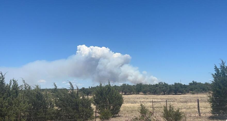  Big Sky Fire burns in the distance in northern Gillespie County