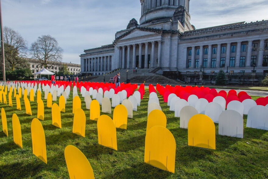 A display in Olympia honors deaths by suicide in Washington. The red markers are suicides by gun.