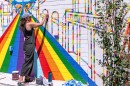 Emily Miquelon paints the mural "Go Together" located in Park City. The mural aims at bringing families and community together to combat underage drinking.