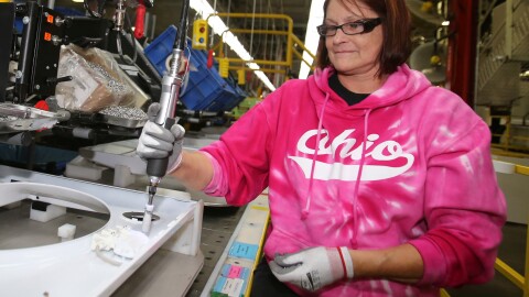 Deb Eisenhawer assembles a switch for a washing machine at a Whirlpool plant in Clyde, Ohio. The company's CEO says steel costs have reached "unexplainable levels."