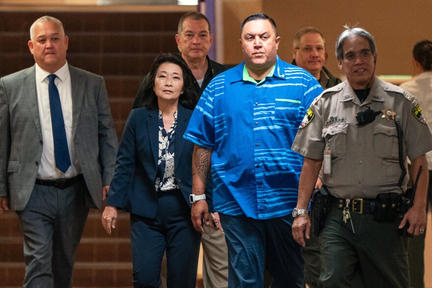 Lt. Gov. Sylvia Luke, second from left, arrives for a court appearance at Kaʻahumanu Hale, accompanied by her attorney and security detail in Honolulu, Thursday, July 30, 2026.