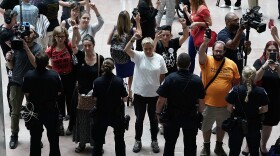 Activists chant during a protest outside the office of Senate Judiciary Committee Chairman Chuck Grassley of Iowa.
