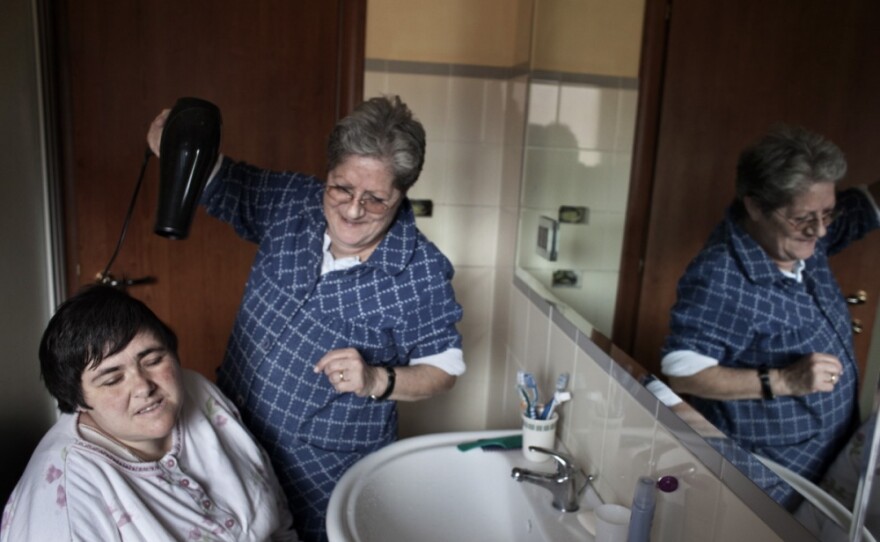 Monia is my sister. She has been disabled since birth. My mother takes care of her every day, every hour, always. Monia's world is a world away from everything else — solitary, confined, but not empty — where time is made up of moments, a present that does not need to project into the future.