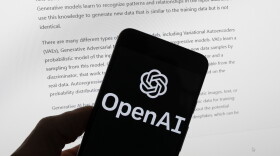 FILE - The OpenAI logo is seen on a mobile phone in front of a computer screen displaying output from ChatGPT, March 21, 2023, in Boston. As state lawmakers rush to get a handle on fast-evolving artificial intelligence technology, they're often focusing first on their own state governments before imposing restrictions on the private sector. Legislators are seeking ways to protect constituents from discrimination and other harms while not hindering cutting-edge advancements in medicine, science, business, education and more.