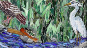 The mosaic showing the Charles River before the Industrial Revolution is one of three large, community art panels in Waltham.