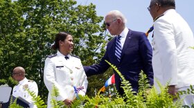 President Joe Biden congratulates Cadet Daisy Anne Atayan, one of the two first female Philippine Coast Guard-sponsored cadets, during the commencement for the United States Coast Guard Academy in New London, Conn., Wednesday, May 19, 2021.