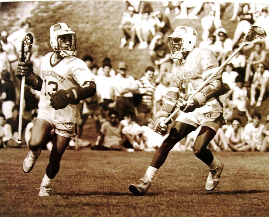 Syracuse defenseman Fred Opie covering a Massachusetts player