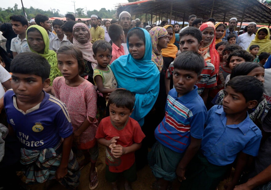 Rohingya Muslim refugees wait for relief supplies at Thaingkhali refugee camp in Ukhia on Oct. 20, 2017.
Some 582,000 Rohingya refugees have fled their homes in Myanmar and arrived in Bangladesh since late August, the United Nations said Oct. 17, warning that thousands more were stranded at the border. (Tauseef Mustafa/AFP/Getty Images)