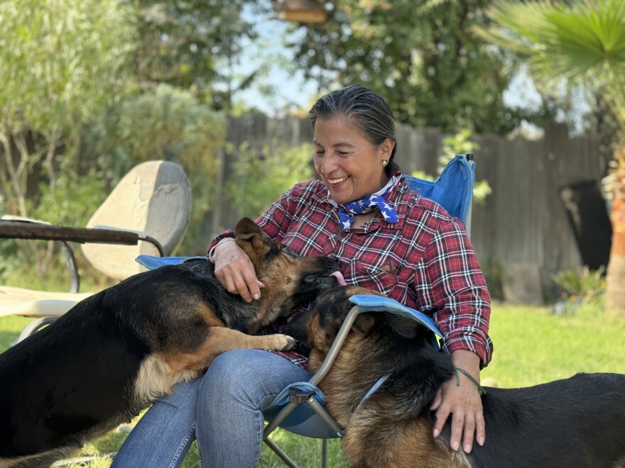 Cardenas' loves to watch her two dogs, Chiquita and Gordo, play in her front yard.