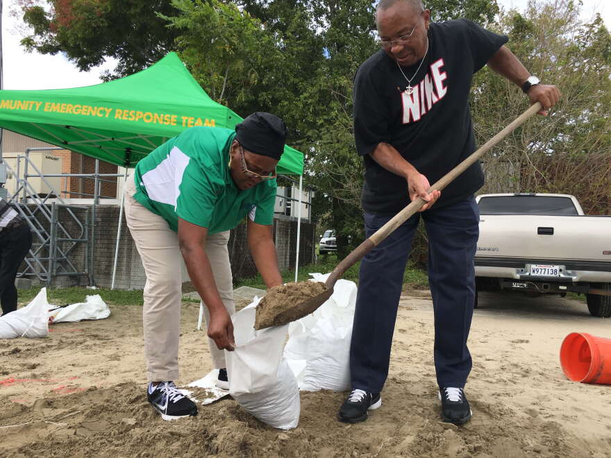 Lakeview residents fill sandbags at their local fire station to prepare for Hurricane Nate in 2017. 