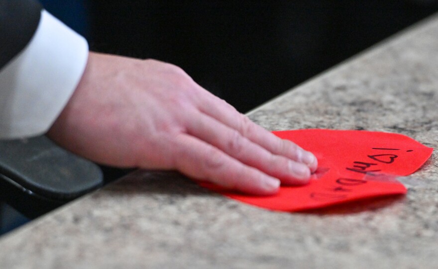 New Wilkes-Barre Police Chief Michael Boyle holds a card given to him from his daughter Casey, 6.