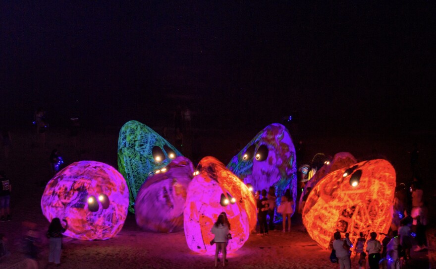 Archaea lit up at night along the lakeshore of McKinley Beach in Milwaukee, Wis.