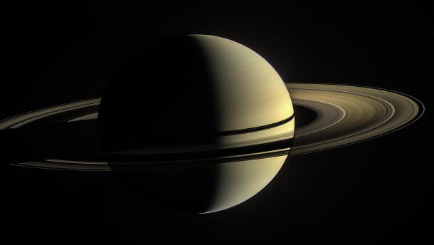 This was the Cassini spacecraft's view from orbit around Saturn on Jan. 2, 2010. In this image, the rings on the night side of the planet have been brightened significantly to more clearly reveal their features. On the day side, the rings are illuminated both by direct sunlight, and by light reflected off Saturn's cloud tops.
