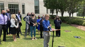 Dylan Brandt speaks at a news conference outside the federal courthouse in Little Rock, Ark., on Wednesday, July 21, 2021. Brandt, 15, has been receiving hormone treatments and is among several transgender youth who challenged a state law banning gender confirming care for trans minors.