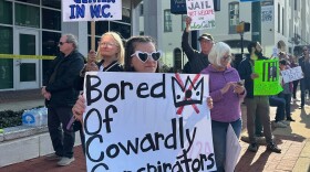 Protesters rally against a planned immigration detention facility outside a Washington County Commission meeting in Hagerstown, Md., Tuesday, March 31, 2026. (AP Photo/Nathan Ellgren)