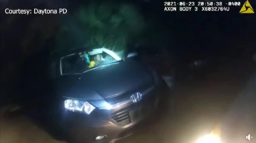 Screengrab shows a car's front at night