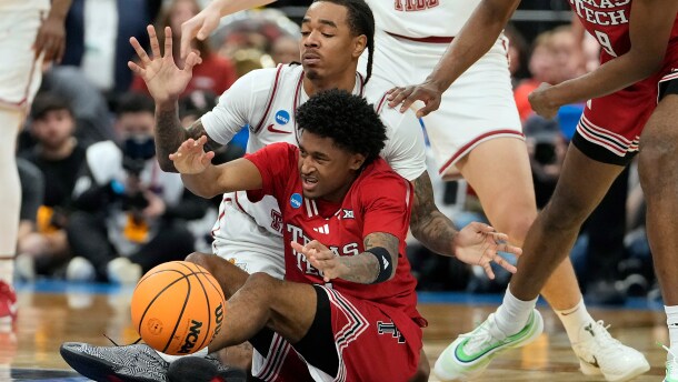 Texas Tech guard Jaylen Petty (11) battles with Alabama guard Labaron Philon (0) for a loose ball during the first half in the second round of the NCAA college basketball tournament Sunday, March 22, 2026, in Tampa, Fla. (AP Photo/Chris O'Meara)