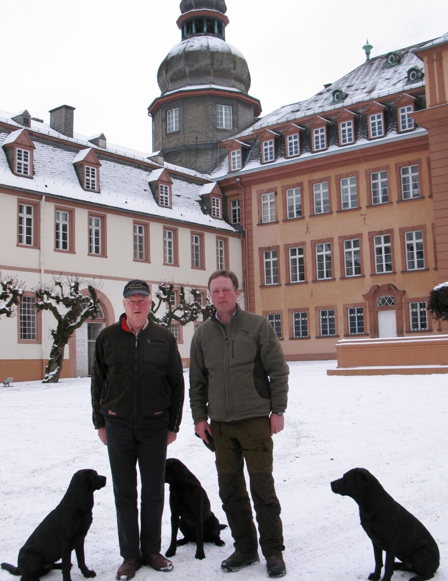 Prince Richard (left) and his son, Prince Gustav, stand in front of their palace in Bad Berleburg. The elder prince decided to reintroduce wisents into the wild in Germany a decade ago, but opponents and red tape hampered his efforts until recently.