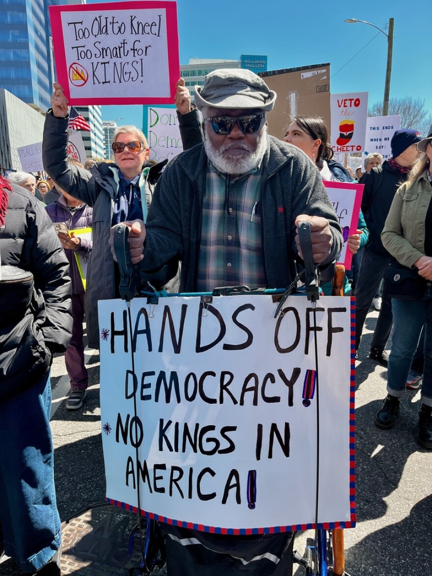 Robert Barr, 77, drove to Richmond, Virginia, from nearby Caroline County for the No Kings rally and marched the two-mile loop through the city using his walker. (Photo by Ian Stewart for Virginia Mercury)