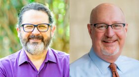 Two portraits of the 2022 candidates for Gainesville mayor are edited side by side. On the left, in a purple polo, glasses and a beard, is Ed Bielarski. On the right, in a blue collared shirt and red tie, glasses and a goatee, is Harvey Ward.