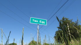 In this April 18, 2016 photo, a sign welcomes motorists to the town of Two Egg, Fla. Located about 70 miles northwest of Tallahasee, Fla., Two Egg is a small farming community where people used to trade eggs for goods. (AP Photo/Brendan Farrington)