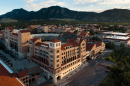The campus of the University of Colorado Boulder, with tall buildings and red-tiled roofs. 