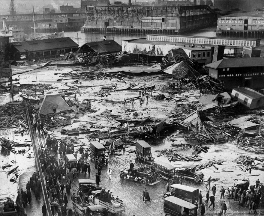 The ruins of tanks containing 2.5 million gallons of molasses lie in a heap after an eruption that hurled trucks against buildings and crumpled houses in the North End of Boston on Jan. 15, 1919.