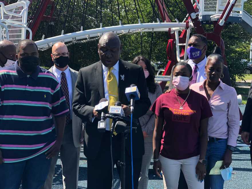 Attorney Ben Crump joined by Micah “Dew” Tennant’s parents Samuel Dunmore (left) and Angela Tennant along with Micah’s aunt Monica Tennant (far right) as he announces a lawsuit against the Pleasantville Board of Education and NJSIAA.