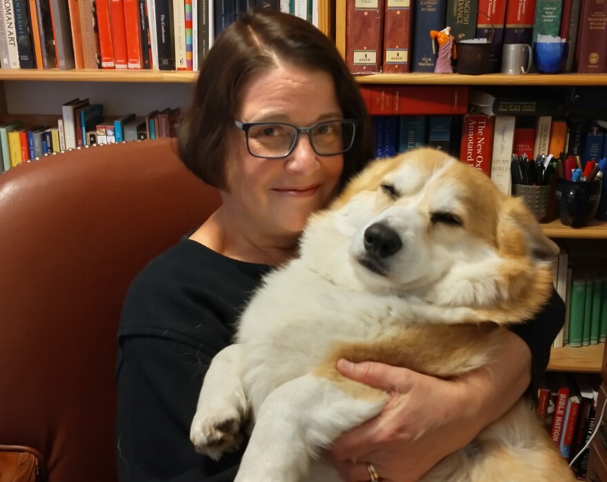Sarah Ruden holds her very fluffy dog