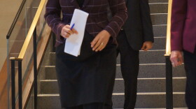 Governor Gretchen Whitmer on her way to sign a bill to boost the earned income tax credit and restore retirement income tax break.
