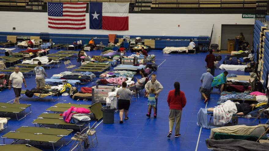 Evacuees from Hurricane Harvey gather at the Delco Center in Austin, Texas, on Sunday. The Red Cross says there were 185 people at this location but that it is prepared to handle up to 350 people if needed.