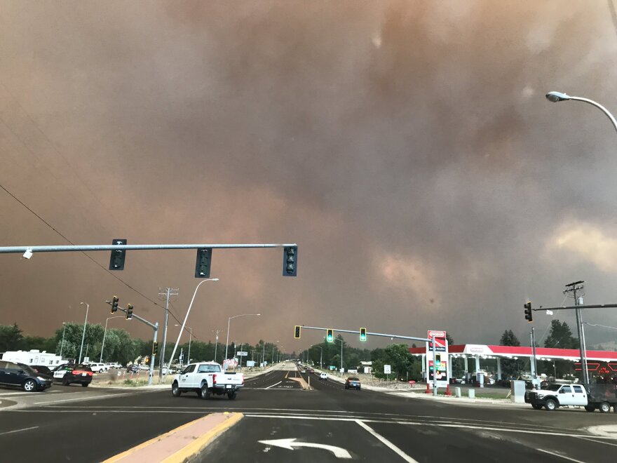 Smoke from the Lolo Peak Fire fills the town of Lolo, August 17, 2017.