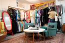 A shopper looks at a rack at Mothership, a vintage and thrift store, Thursday, March 26, 2026, in New York. (Alyssa Goodman/AP)