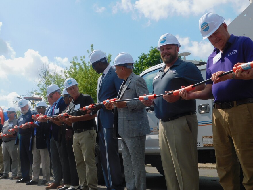 Government and private sector leaders take part in a symbolic start of a 111 mile long fiber optic connection between Port Huron and Flint.