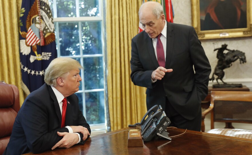 President Trump listens to White House chief of staff John Kelly following Trump's meeting to discuss potential damage from Hurricane Michael in October 2018. Kelly saw his role in the White House as Trump's gatekeeper.